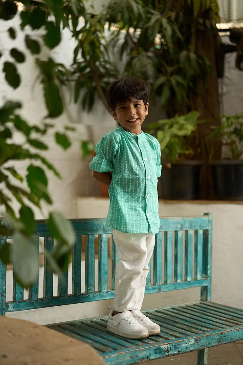 Barefoot Boy’ mandarin collar hand block printed malmal cotton unisex full sleeve summer shirt in blue with white polka dots for boys and girls